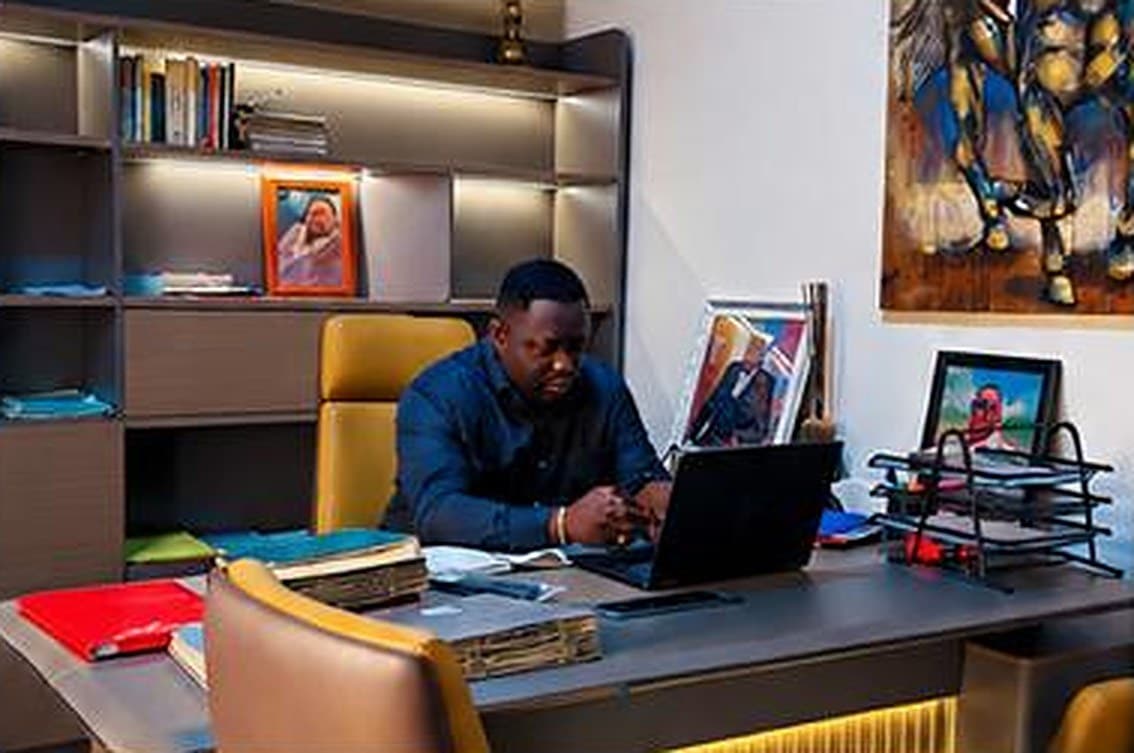 Me Lionel Mbembo at his desk