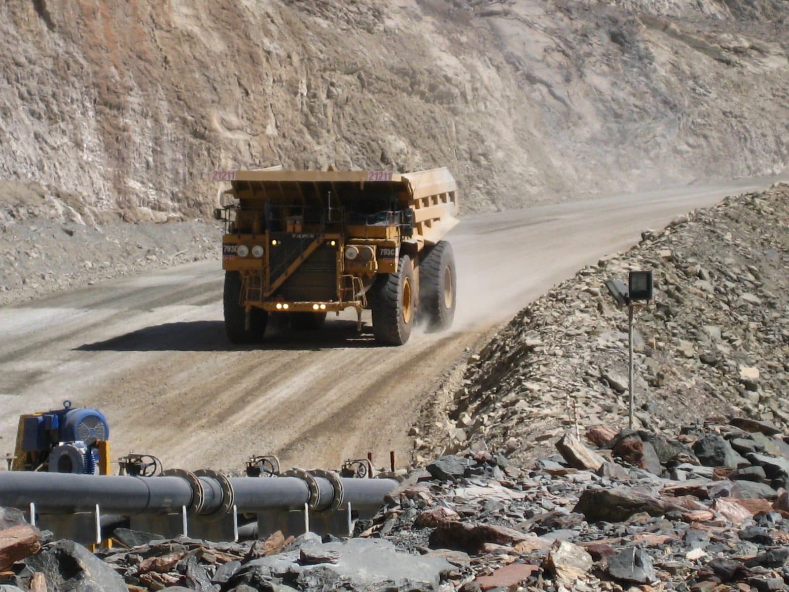 Loaded mining haul truck on a dirt road